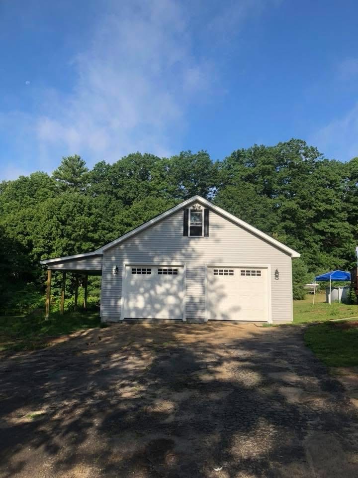 Detached two-car garage with attached lean-to built in Southern Maine