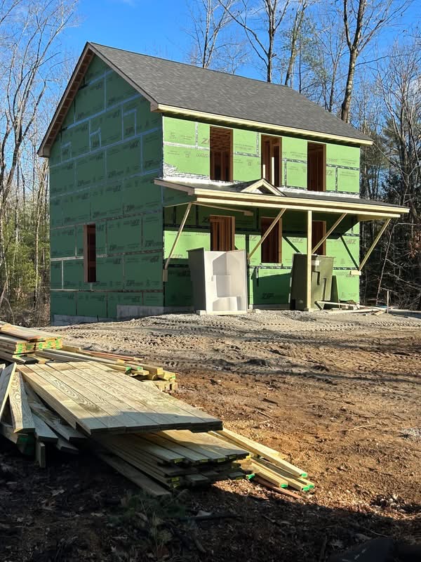 Two-story colonial sheathed with ZIP System panels and framed farmer's porch