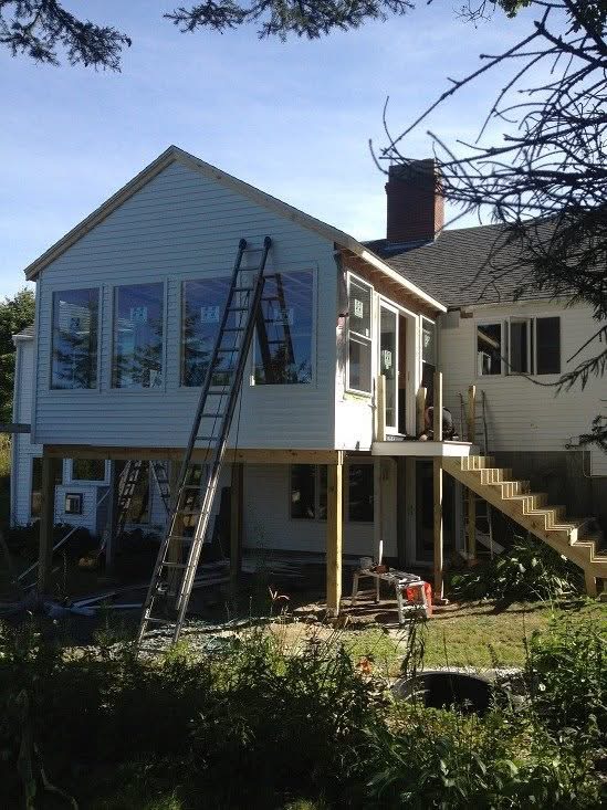 Elevated second-story addition sided and windows installed